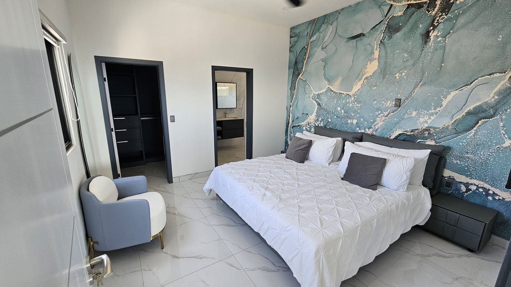 Bedroom with blue feature wall