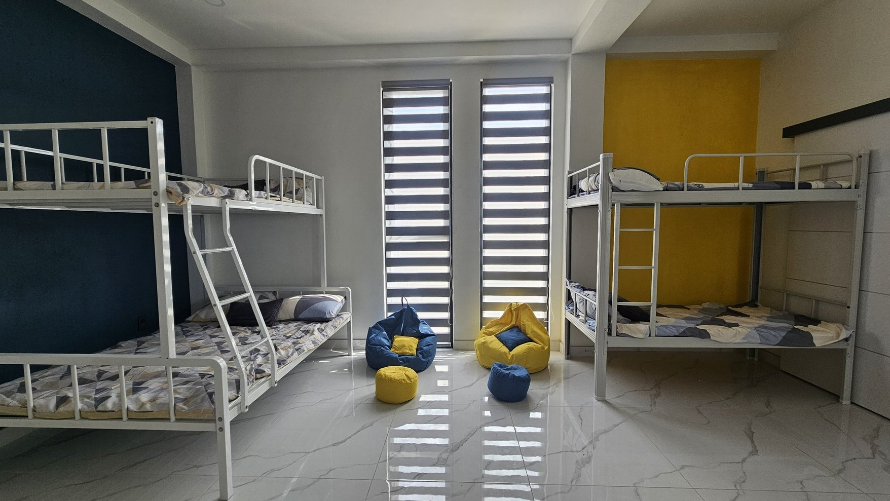 Bunk room with blue and yellow accents
